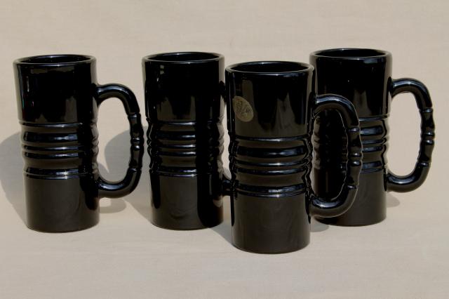 photo of set of four opaque black glass mugs or steins w/ vintage Tiara glass labels #1