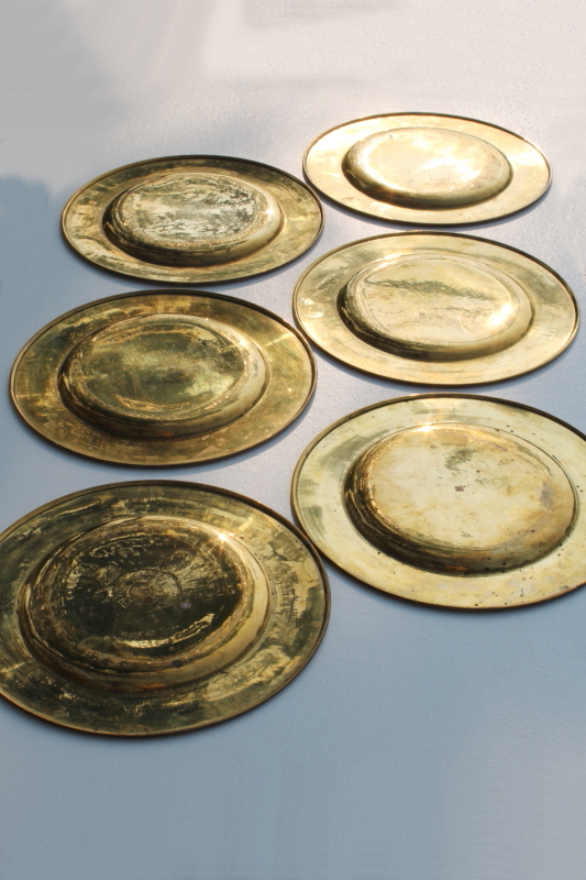 photo of set of six vintage solid brass chargers, large plates 11 and 3 quarters diameter heavy brass under plate trays #8