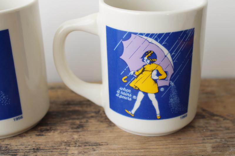 photo of set of vintage china coffee mugs, Morton salt girl 1914 - 1921 - 1956 - 1968 ad graphics #5