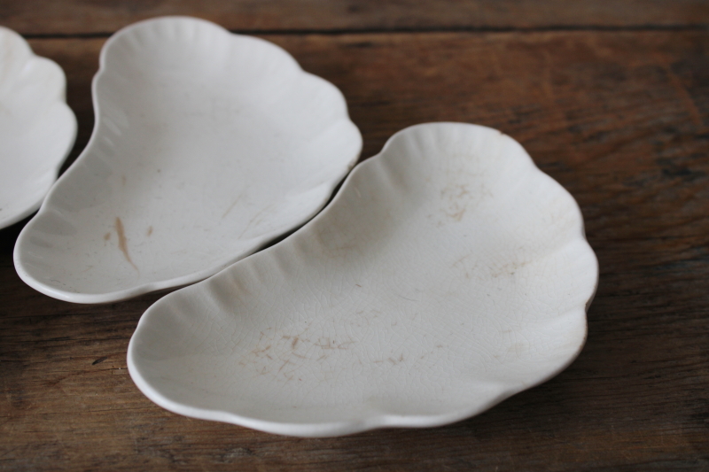 photo of shabby antique stained white ironstone china bone dishes, small crescent shaped plates  #2
