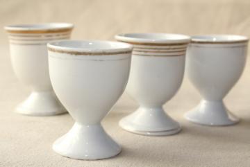 catalog photo of shabby antique white porcelain egg cups, mismatched vintage china set