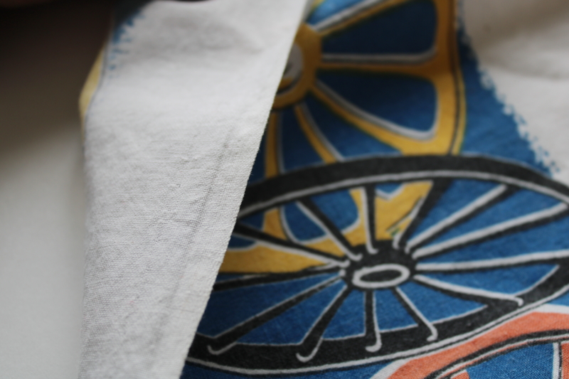 photo of shabby faded vintage cotton feed sack fabric, western wagon wheels border print  #2