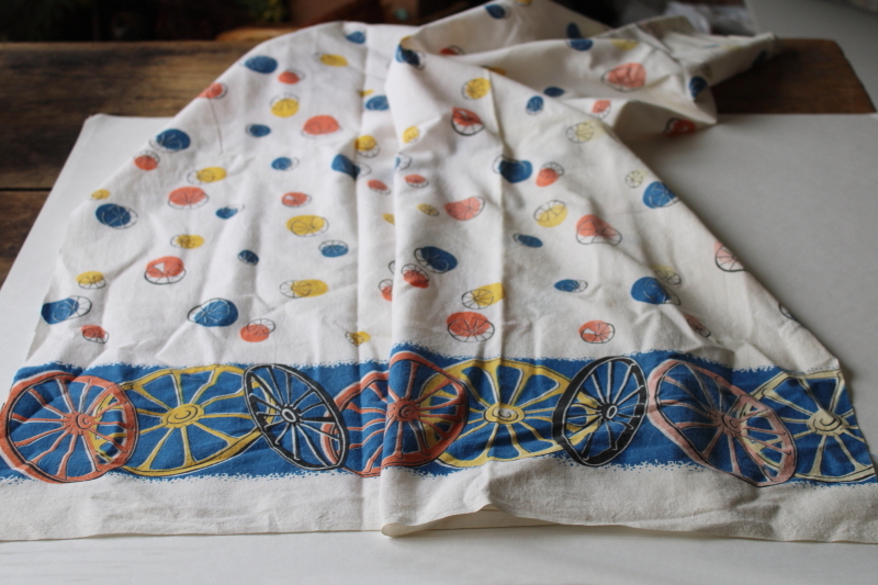 photo of shabby faded vintage cotton feed sack fabric, western wagon wheels border print  #5