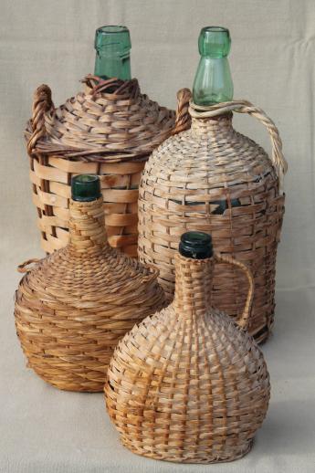 photo of shabby vintage basket covered bottles, lot of old green glass wine bottles in baskets #1