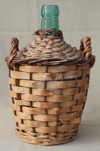 photo of shabby vintage basket covered bottles, lot of old green glass wine bottles in baskets #3