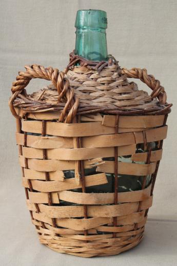 photo of shabby vintage basket covered bottles, lot of old green glass wine bottles in baskets #4