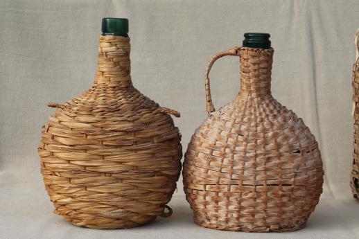 photo of shabby vintage basket covered bottles, lot of old green glass wine bottles in baskets #8