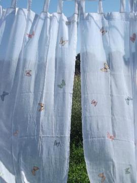 catalog photo of sheer white cotton organdy curtains, embroidered butterfly appliques