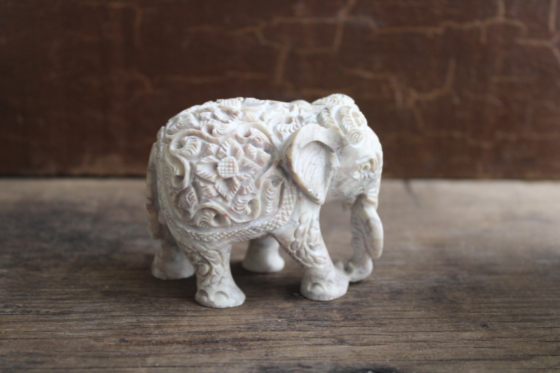 photo of small carved elephant figurine boho flowers, cultured marble stone composition  #1