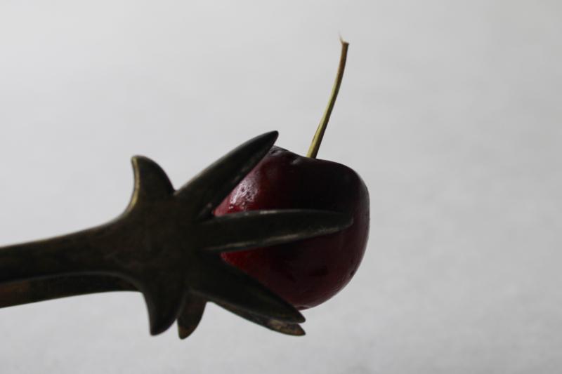 photo of small solid brass tongs w/ gothic style bird foot or claws shape, vintage Halloween #4