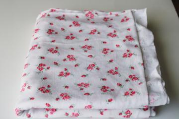 catalog photo of soft all cotton jersey knit fabric pink floral on white, nice for baby doll clothes