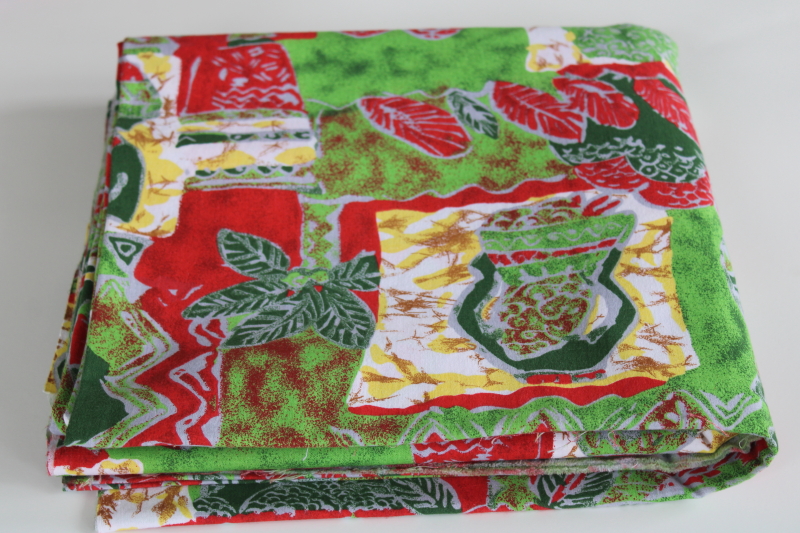 photo of soft cotton fabric w/ Africa ethnic print, people & palm trees in greens & red block print style #4