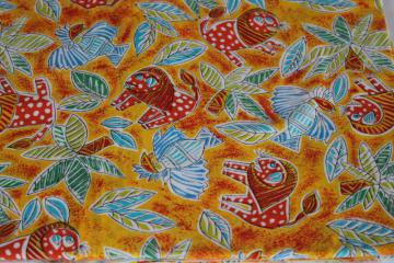 photo of soft cotton fabric w/ colorful ethnic print, lions, palm trees, lightning birds
