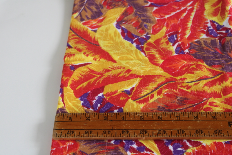 photo of soft cotton fabric w/ tropical palm leaves print in bold colors red, yellow, purple, brown #4