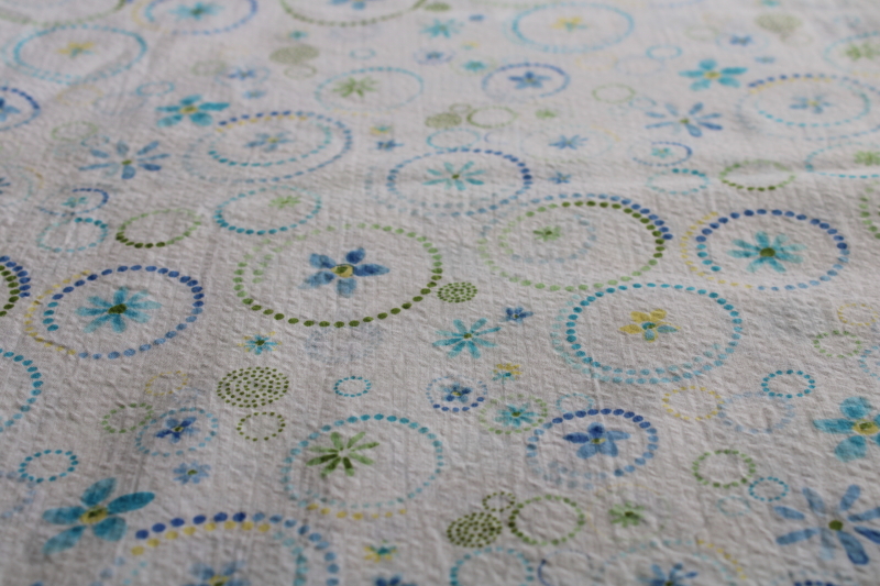 photo of soft crinkle cotton plisse fabric, flowers print in aqua, blue, yellow, shades of green #3