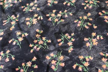 photo of soft crinkle rayon / poly fabric, coral orange floral print on black, boho vintage