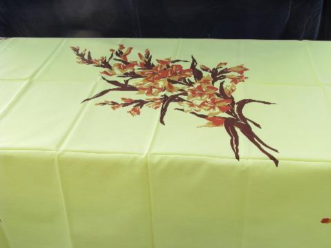 photo of spray of liles on yellow, vintage 1950s printed cotton kitchen tablecloth #1