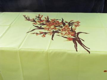catalog photo of spray of liles on yellow, vintage 1950s printed cotton kitchen tablecloth