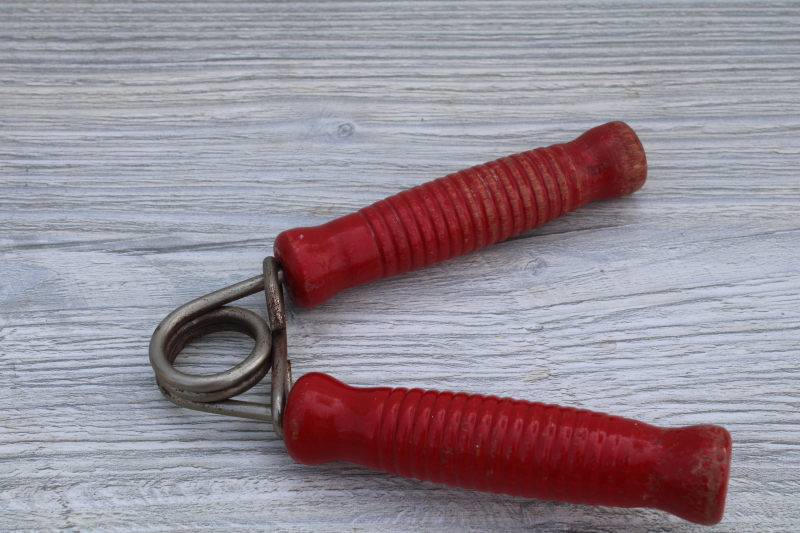 photo of squeeze grip hand strengthener w/ red painted wood handles, 1950s vintage fitness equipment #2