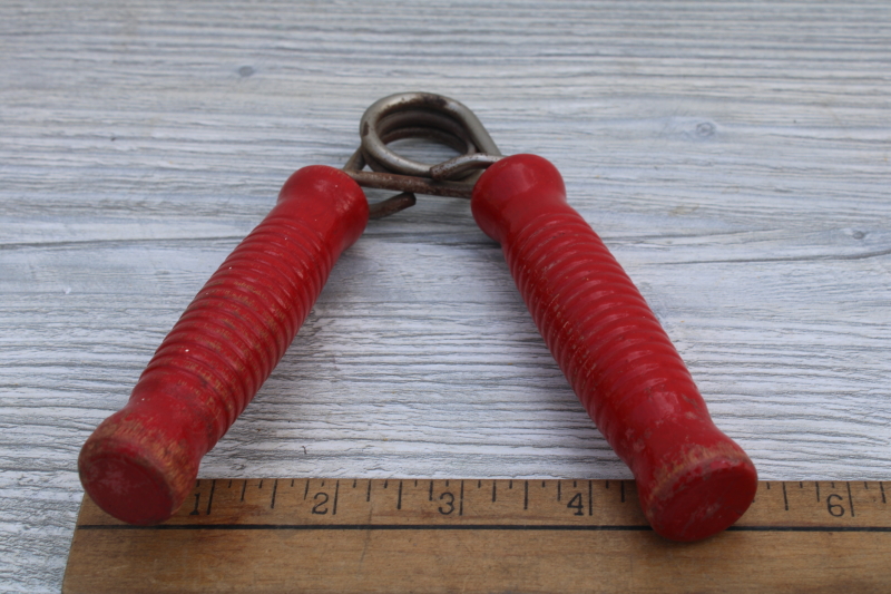 photo of squeeze grip hand strengthener w/ red painted wood handles, 1950s vintage fitness equipment #3