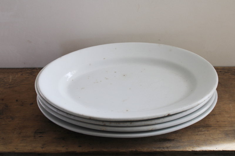 photo of stack of antique ironstone platters, heavy white china w/ early England backstamps #1