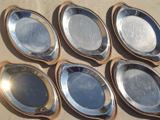 photo of steakhouse style sizzling steak plates, oval stainless platters w/ wood boards #2