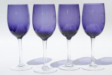 catalog photo of tall water glasses or wine goblets, clear stem violet blue stemware