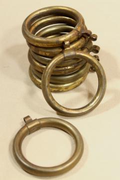 catalog photo of tarnished patina vintage brass curtain rings, round ring drapery hangers for big modern rods