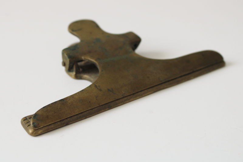 photo of tarnished vintage solid brass desk papers clip, large spring clip for paper organization, storage or display  #1