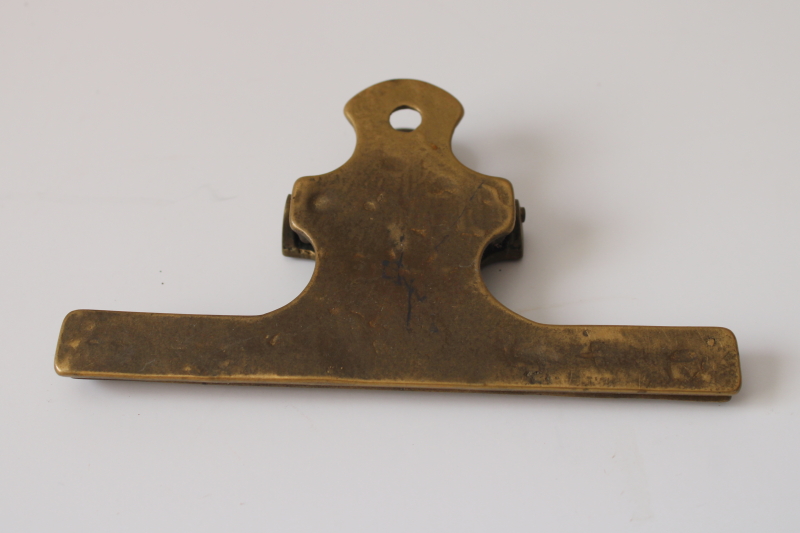photo of tarnished vintage solid brass desk papers clip, large spring clip for paper organization, storage or display  #4