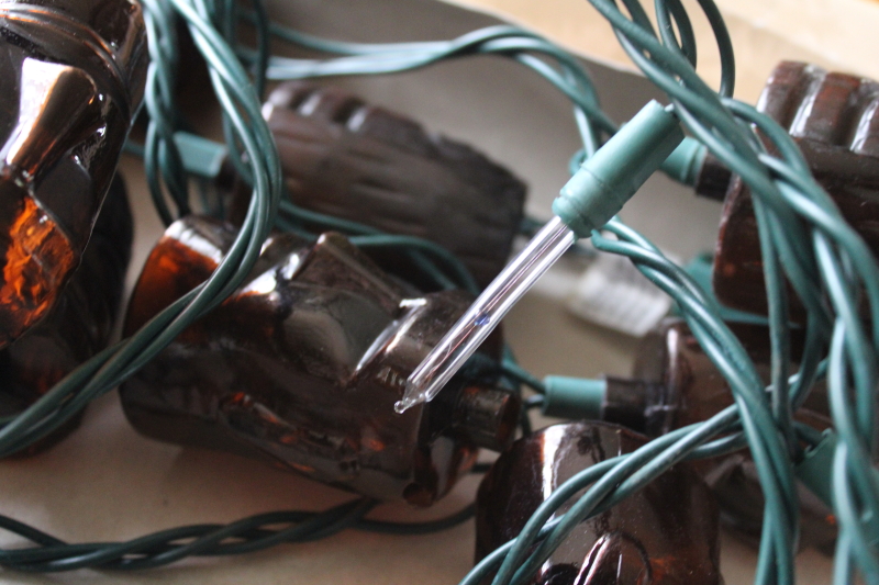 photo of tiki head mini lights, retro party or bar decor, root beer brown plastic tikis w/ long light bulbs  #4