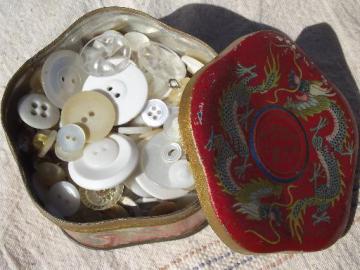 catalog photo of tin full antique and vintage buttons, white and ivory, mother of pearl shell etc.