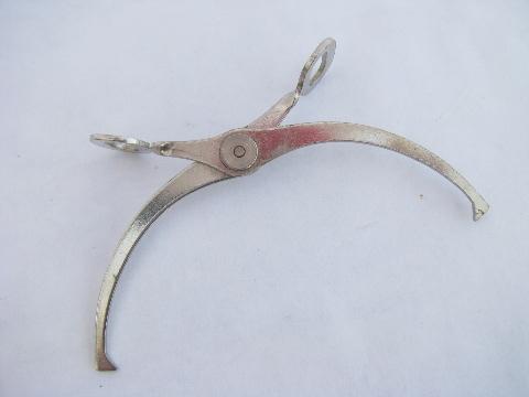 photo of tiny 1920s vintage sugar cube tongs, nickel plate over steel #1