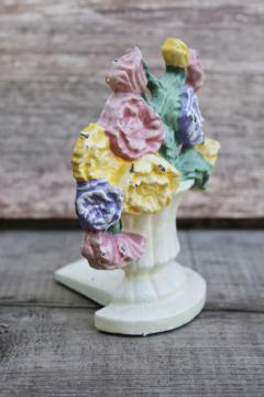 catalog photo of tiny cast iron doorstop, chippy paint bouquet of flowers vintage door stop 