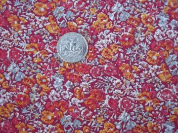 catalog photo of tiny floral quilting print cotton fabric, flowers in sunset orange and red