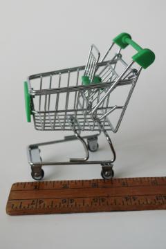 catalog photo of tiny metal shopping cart, doll sized toy grocery cart w/ real wheels, green handle 