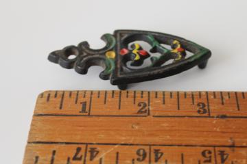 catalog photo of tiny miniature cast iron trivet, doll sized sadiron trivet, vintage souvenir or salesman's sample 