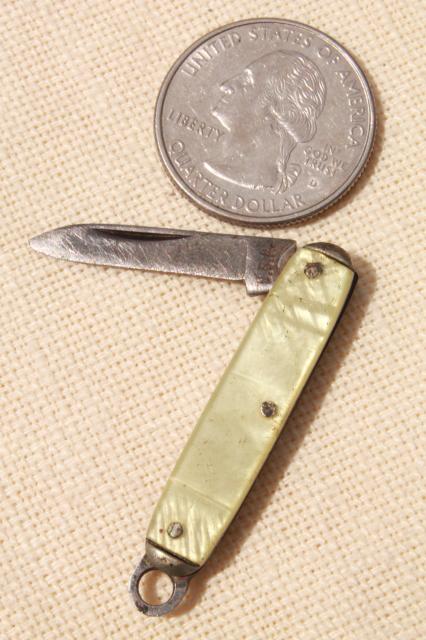 photo of tiny miniature pocket knife, vintage folding penknife mother of pearl shell #1