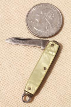 catalog photo of tiny miniature pocket knife, vintage folding penknife mother of pearl shell