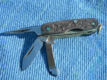 catalog photo of tiny old tooled sterling silver pocket knife w/western leather case