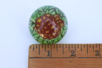 catalog photo of tiny paperweight hand blown glass millefiori, bunch of flowers with green leaves 