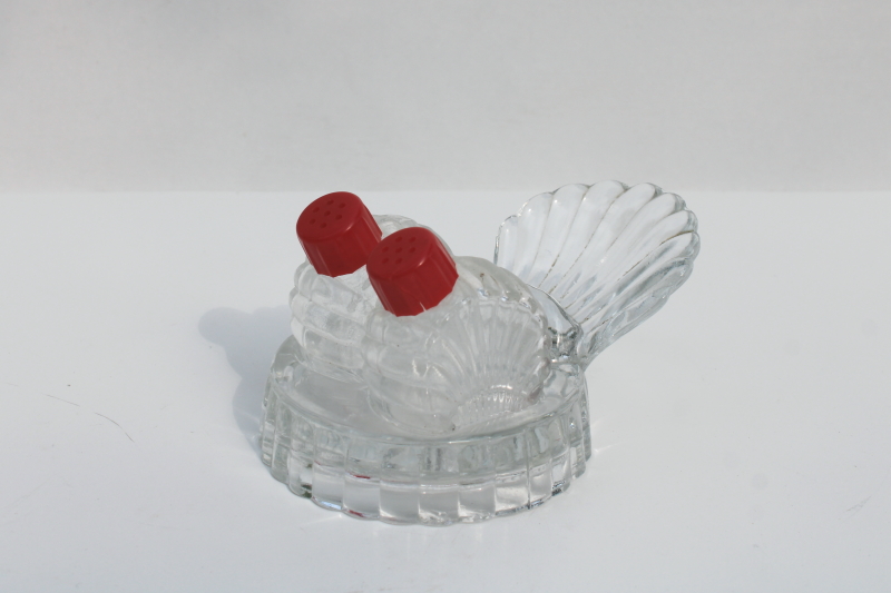 photo of tiny salt and pepper shakers in glass caddy tray, vintage clear glass S&P w/ red plastic lids #1