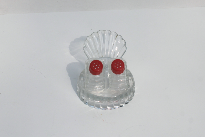 photo of tiny salt and pepper shakers in glass caddy tray, vintage clear glass S&P w/ red plastic lids #2