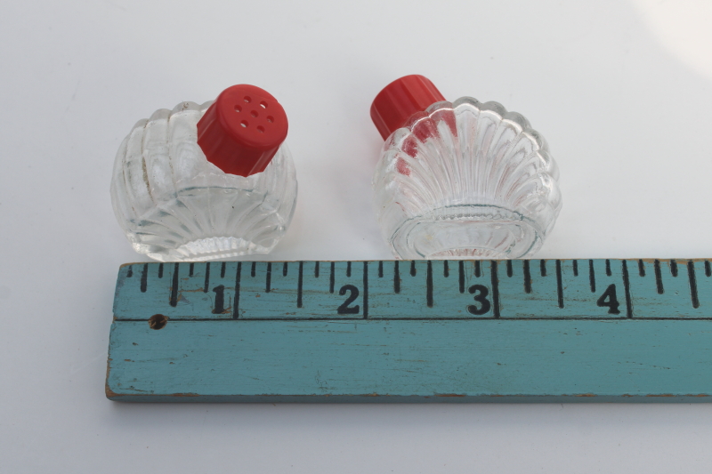 photo of tiny salt and pepper shakers in glass caddy tray, vintage clear glass S&P w/ red plastic lids #5