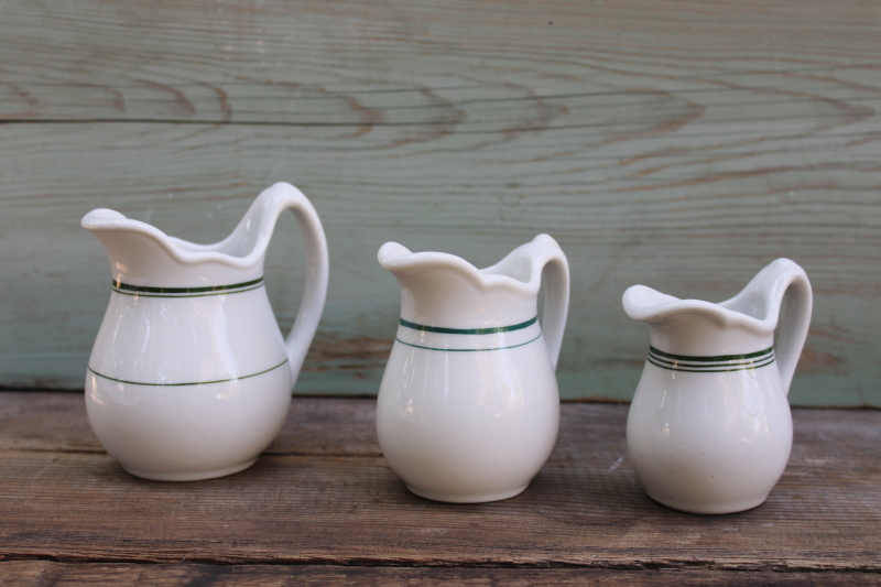 photo of trio of vintage ironstone china pitchers, chunky creamers stair step sizes green band patterns #1