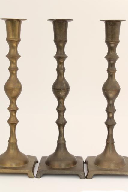 photo of trio of vintage tarnished brass candle sticks, tall altar candlesticks #2