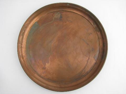 photo of two large round heavy solid copper trays, vintage West Bend #3