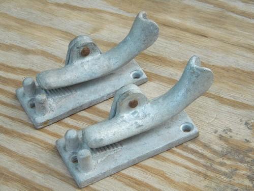 photo of two old airstream vintage cast aluminum clothesline rope clamps #1