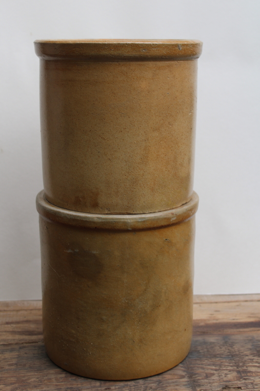 photo of two old worn browned stoneware crocks, large planter pots for trees or greenery, farmhouse kitchen storage  #8