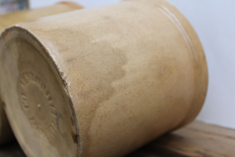photo of two old worn browned stoneware crocks, large planter pots for trees or greenery, farmhouse kitchen storage  #14